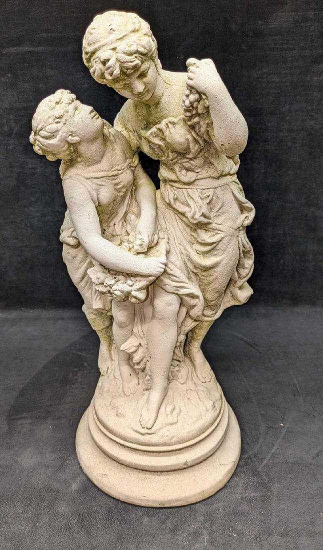 Vintage Garden Statue Of Two Young Ladies: Vintage Garden Statue Of Two Young Ladies. The vintage concrete or stone sculpture's condition and wear is consistent with age and wear. The statue has some cracks and chips and a sort of mossy residu