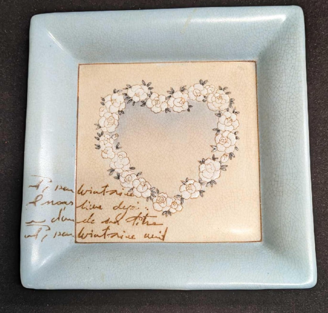 Jardin D'Ulysse Porcelain French Ashtray With Heart Of Flowers: Jardin D'Ulysse Porcelain French Ashtray With Heart Of Flowers. This is approx 7" x 7" x 1" and it weighs 1.35lb. The ashtray has crazing and some markings. Please note, the handwriting is part of