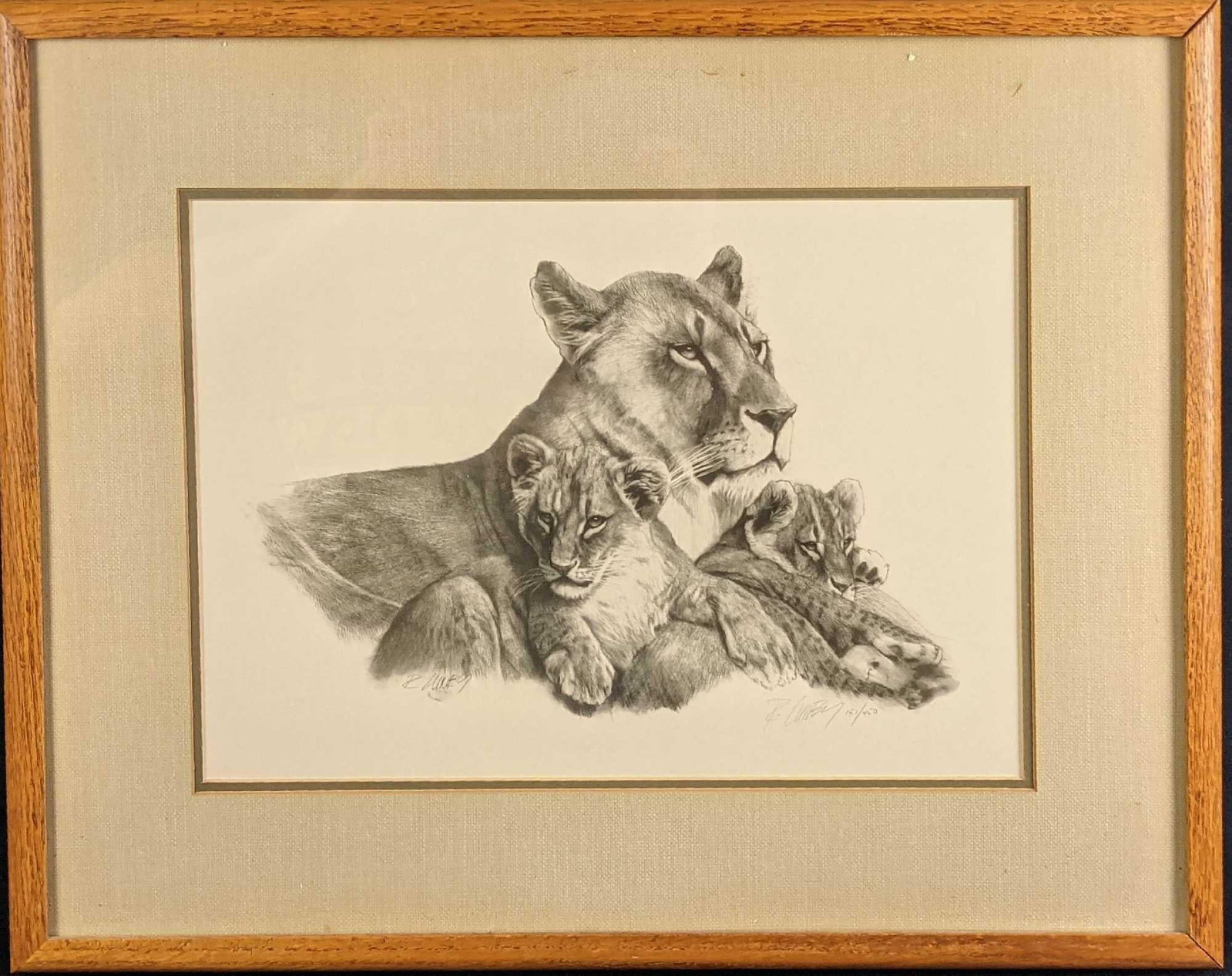 Framed LE Lithograph Print Lioness And Cubs: Limited edition lithograph of a lioness and her two cubs, by artist, Richard Luney. Is #151 out of #450. Signed and numbered by the artist on the bottom right of the print. The framed print is approx 