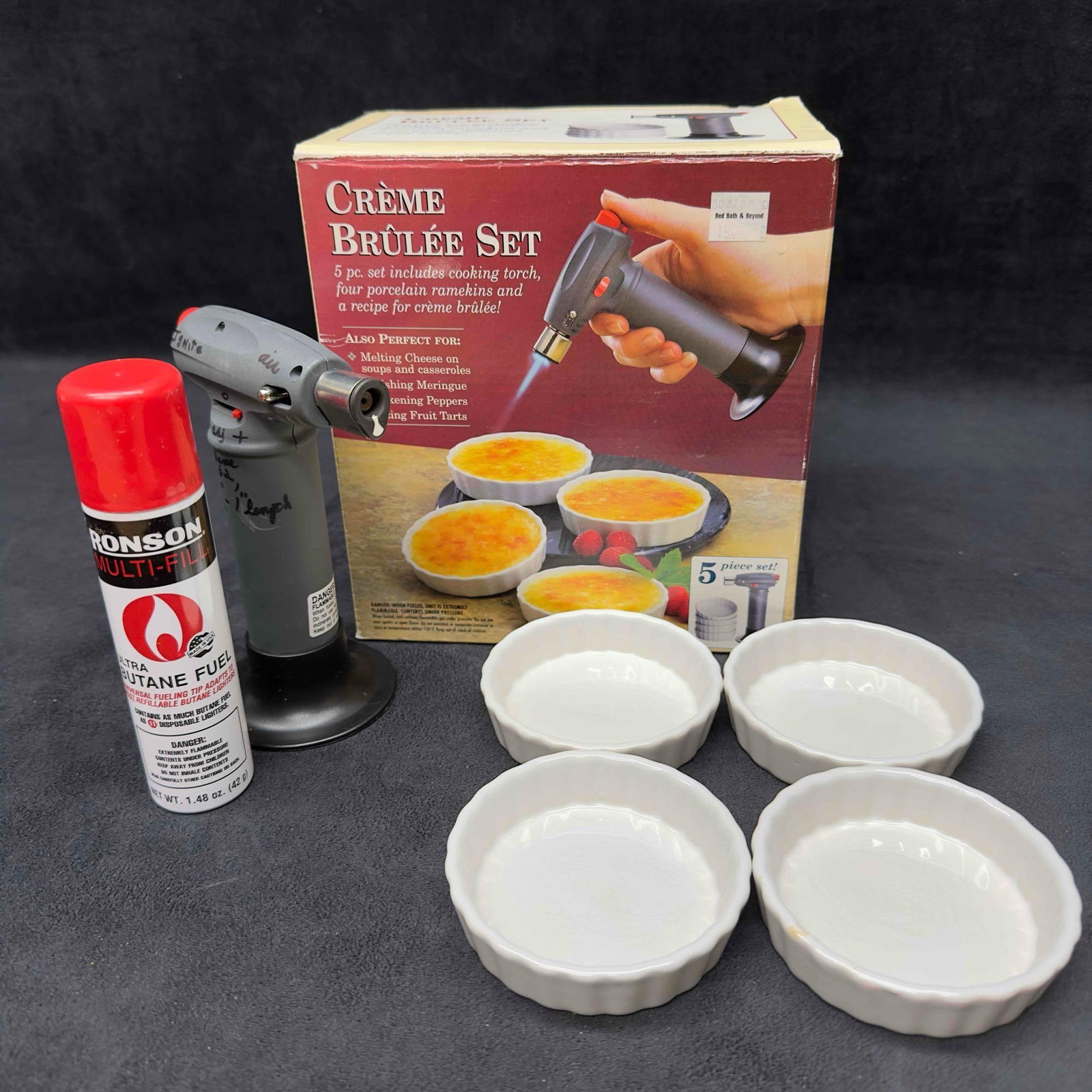 Bon Jour Creme Brulee Set Four White Ramekins and Cooking Torch Cheese Meringue: Bon Jour Creme Brulee Set Four White Ramekins and Cooking Torch Cheese Meringue. Includes butane refill, torch, and four (4) ramekins. This item is in good pre-owned, previously displayed condition wi