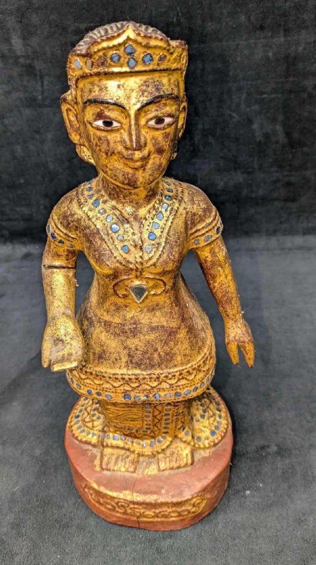 Vintage Thai Or Burmese Carved Gilt Wood Lady Statue: Vintage Thai Or Burmese Carved Gilt Wood Lady Statue. This is approx 7"x 6" x 16 1/2" and it weighs 4.10lb. The statue has some chips, a crack down the middle of the base and a crack on the right arm.