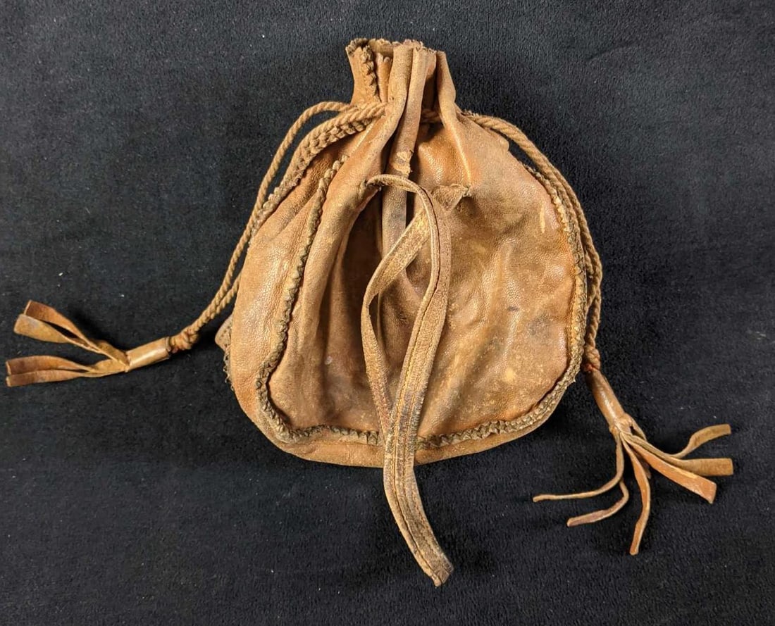 Vintage Leather Pouch Genuine Leather: Vintage Leather Pouch Genuine Leather This is a good little pouch with a drawstring closure and two handles. This pouch is also made with real leather. This item is in good condition with just a