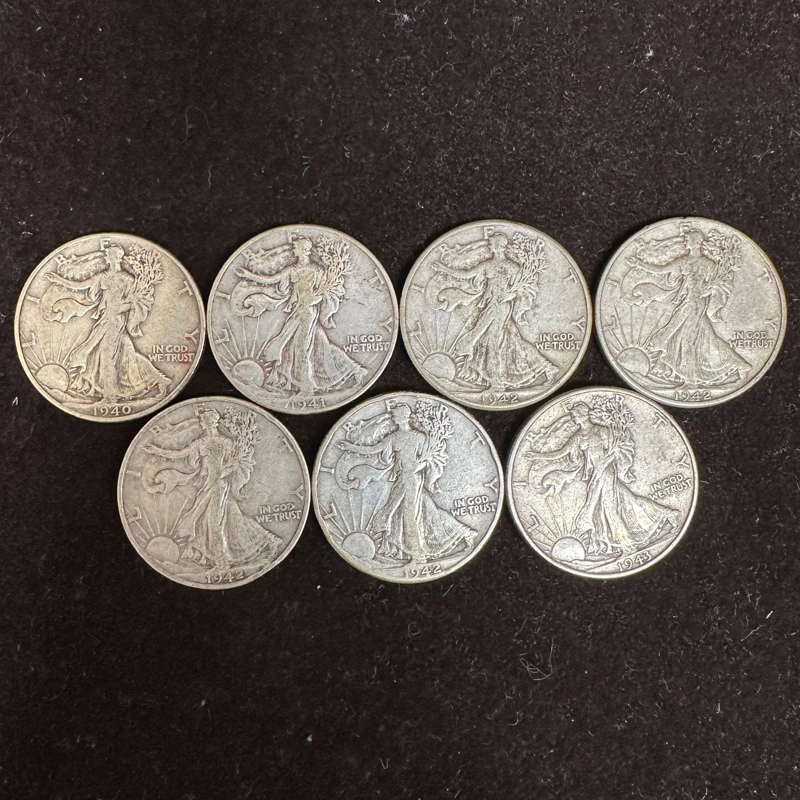Set of Seven Silver Coins 1940s Walking Liberty Half Dollar Coin Collection K95: These coins have been tested and researched to the best of our ability before listing. Please view the photos, as they are a part of the condition. DETAILS: Metal - .900 Silver Tested - Yes Size - 30.