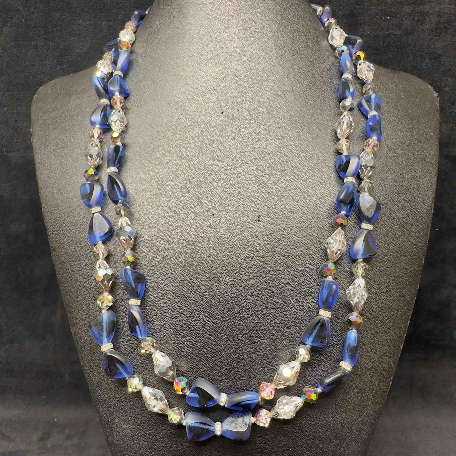 Clear Blue Crystal Glass Beaded Vendome Double Strand Necklace I58: Clear Blue Crystal Glass Beaded Vendome Double Strand Necklace I58. Necklace with clear blue glass beads with beautiful designs. The necklace features a j hook clasp closure. The clasp is etched 