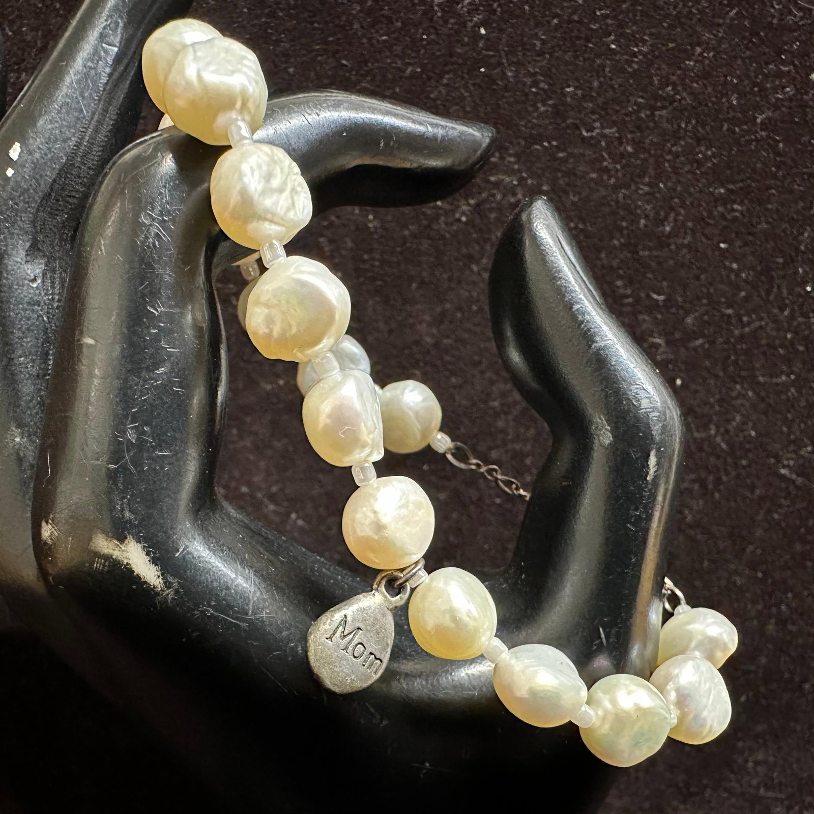 Freshwater River Pearl Strand Bracelet Sterling Mom Charm and Clasp: This item is in good pre-owned, previously used/displayed condition with noticeable light wear and surface scratches. Please reference all photos for full details. This piece of jewelry has been teste