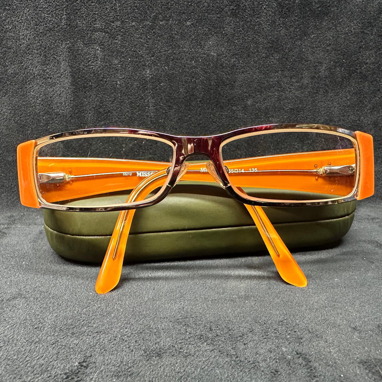 Missoni Rectangular Eyeglass Frames Orange 55-14-135: Designer Missoni rectangular eyeglass frames featuring an orange and tortoiseshell acetate style construction with metal accents. Marked Missoni on the interior arm. Frame size reads 55-14-135. Includ