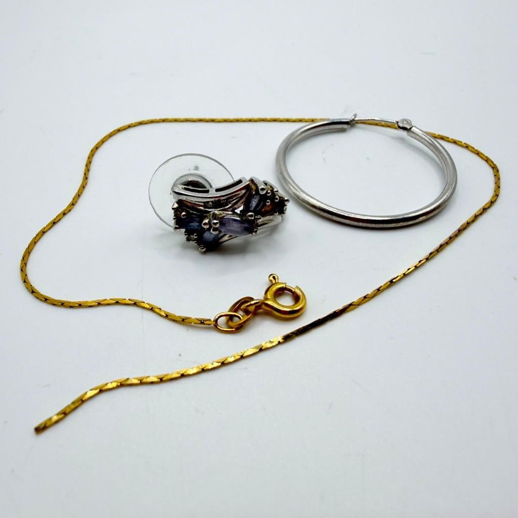 Gold Jewelry Scrap Lot: Gold Jewelry Scrap Lot Gold scrap lot with one 10k white gold earring weighing 1.65 grams, one 14k white gold hoop weighing 0.45 grams, and a broken yellow gold 14k necklace weighing 0.85