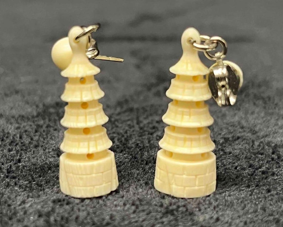 Hand Carved Bone Pagoda Dangle Earrings: This lot contains Hand Carved Bone Pagoda Dangle Earrings. Each earring is approx 1 1/4" x 1/2" x 1/4". Total weight is less than 1 gram. Overall the Hand Carved Bone Pagoda Dangle Earrings is in