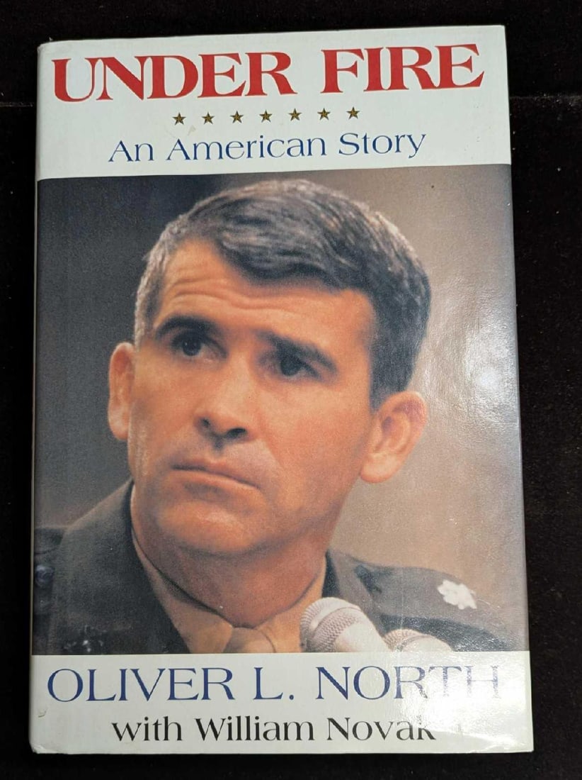 Under Fire An American Story Hardcover Oliver North: Under Fire An American Story Hardcover Oliver North. Published by HaperColins in 1991. The book is approx 6 1/2" x 1 1/2" x 9 1/2" and it weighs 1.94lb. The hardcover book is in 