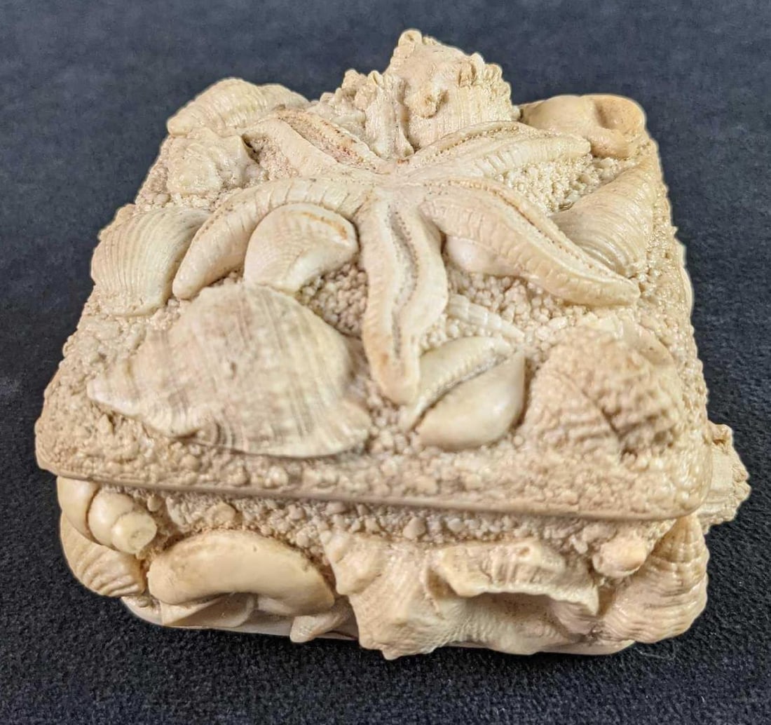 Small Shells Trinket Box Nautica: Here is a small resin trinket box covered with real shells and starfish. Its maker and date of creation are unknown. The box is approx 4" x 4" x 2 1/2" and is in a good, used conditon with light