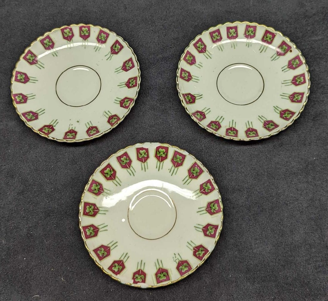 3 Vintage German Porcelain Saucers: 3 Vintage German Porcelain Saucers. Each is hand-painted. The maker and date of creation are unknown. The saucers are approx 4 3/4" and together they weigh 0.50lb. One of the saucers has a chip on the