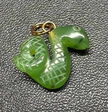 Jade Snake Pendant: This piece of jewelry has been tested and researched prior to listing. Please view all our pictures they are part of our description. DETAILS: Metal - base metal Color - gold Stones - Jade Hallmarks