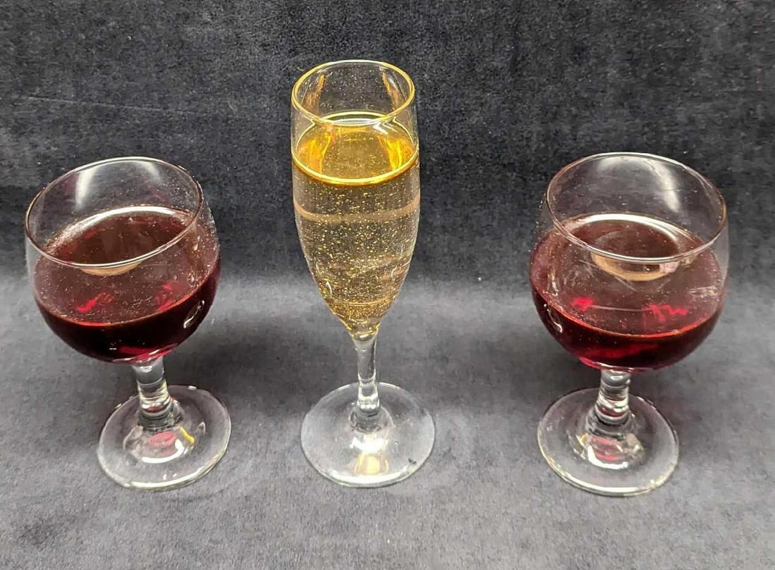 3 Vintage Red Champagne Wine Glass Bottles Prop: 3 Vintage Red White Champagne Glass Bottles Prop. Glasses look like they have wine inside, but these are just props. Makes fun decorations, home staging, photo props, and more. Flip the bottles 