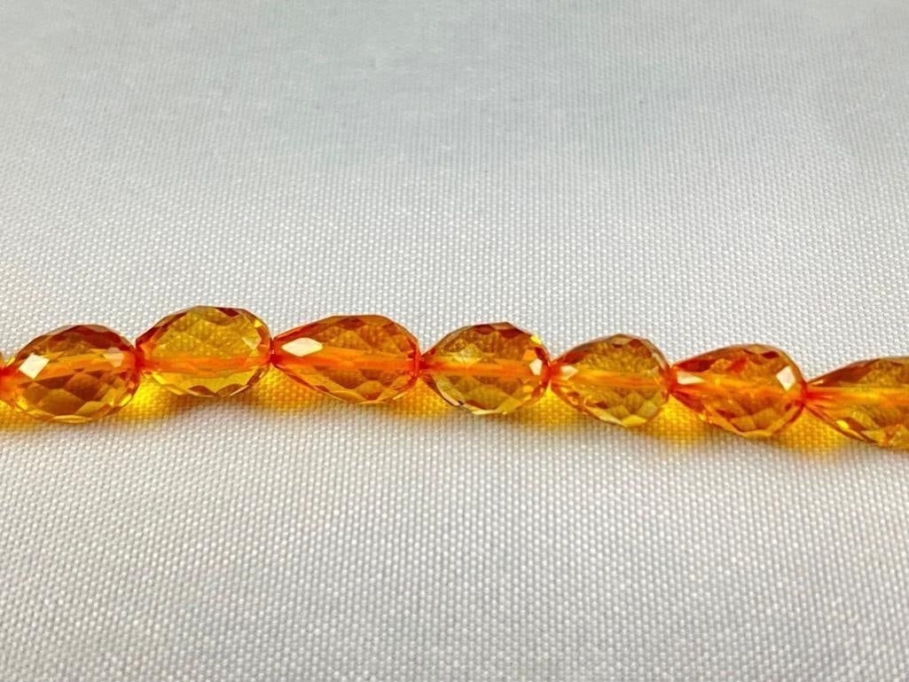 String of Citrine Jewel Beads: String of Citrine Jewel Beads DETAILS: Metal - none Color - orange Size - 9.25" Weight - 7.3 g Markings - none Maker - unknown Stones - Citrine Style - faceted beads Conditio