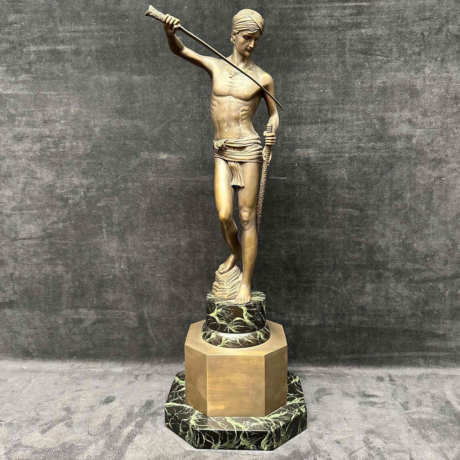 After Marius Jean Antonin Mercie Style David Bronze and Marble Statue Sculpture: This replica after Marius Jean Antonin Mercie David style statue represents David vanquishing Goliath. This sculpture depicts a man with a drawn sword. Cast metal bronze statue sits on a marble pedest