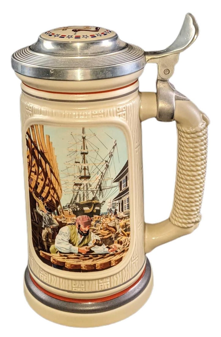 1985 Avon, "The Building of America, The Shipbuilder" LE Beer Stein: 1985 Avon, "The Building of America, The Shipbuilder" LE Ceramic Beer Stein. Is #28983. The stein is approx 6" x 4" x 9" and weighs 2.23lbs. The stein is in a good, vintage condition with light wear o