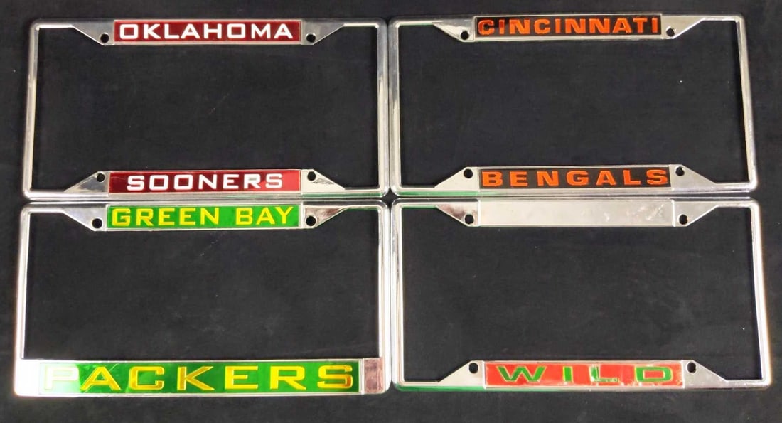 4 Metal License Plate Frames Football Bengals: Four Metal License Plate Frames. Lot includes: (1) Oklahoma Sooners (1) Cincinnati Bengals (1) Green Bay Packers (1) Wild. These are approx 12" x 6". Frames are in good, used condition wi