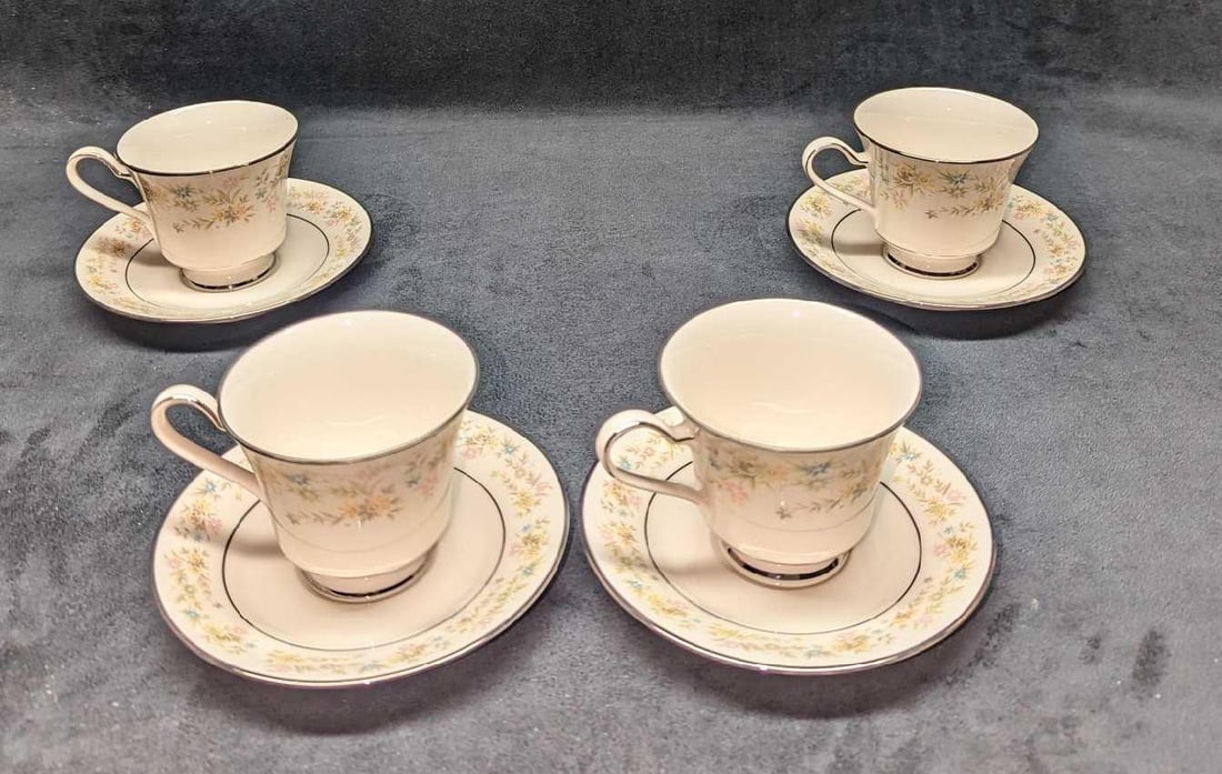 4 Retired Noritake Blossom Time Footed Cup & Saucers A: 4 Retired Noritake Blossom Time Footed Cup & Saucers A. The "Blossom Time" design was released from the year 1972 to the year 1985. Made of Ivory China. This lot includes: (4) Footed Cup. 