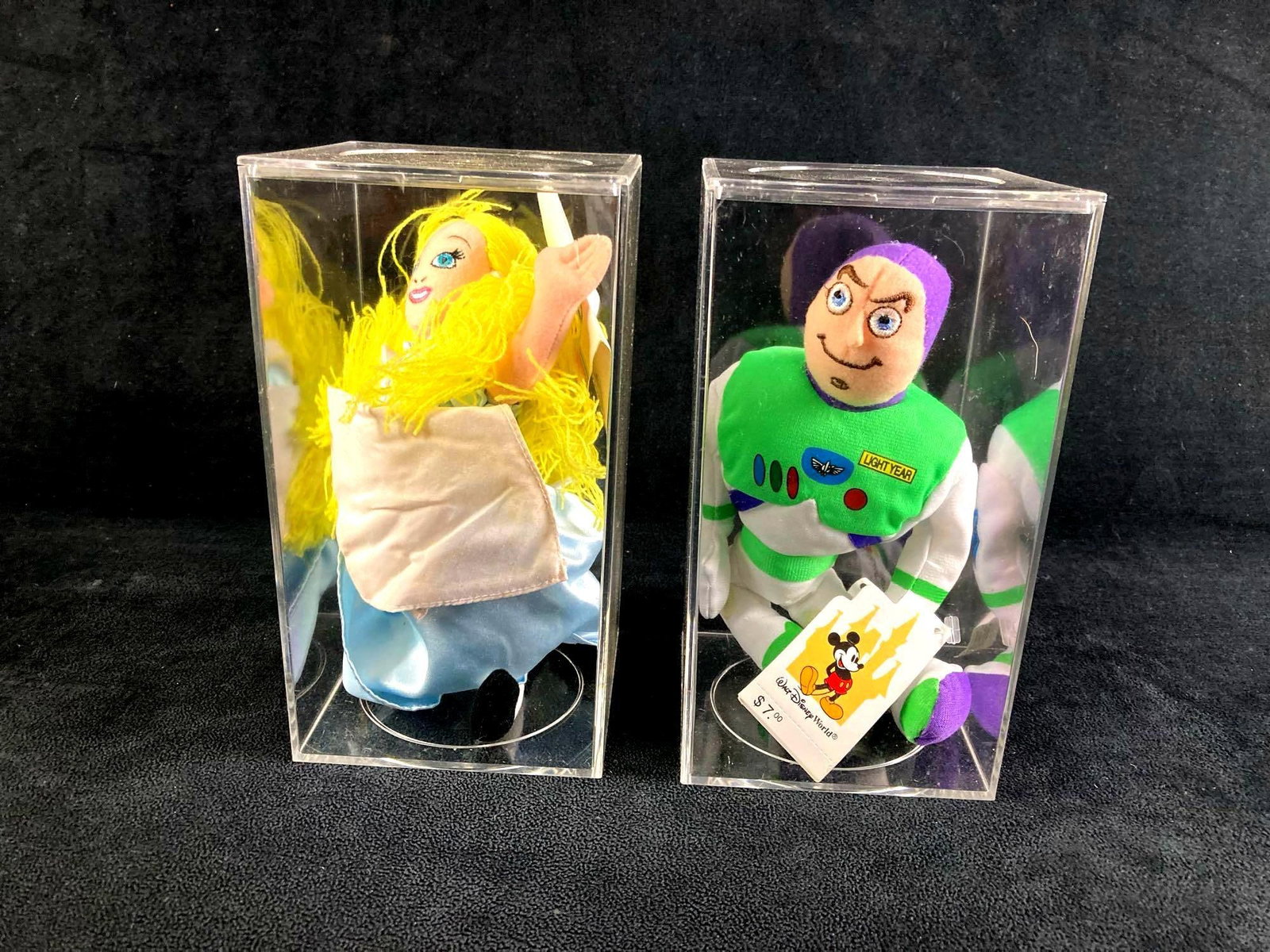 Set of (2) Disney Bean Bag Dolls Alice and Buzz Lightyear: This lot includes: (1) Alice Bean Bag Doll (1) Buzz Lightyear Bean Bag Doll Condition is used and refer to photographs for additional details. The dolls are in good shape with slight discoloration.