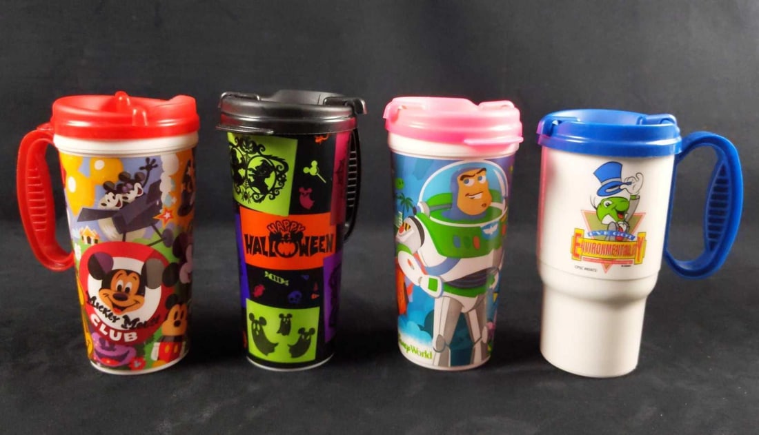4 Disney World Resort Mugs Mickey Pixar Halloween: Here are four Walt Disney World Resort Mugs. Each is in good, used condition with some minor wearing on the sides. They need to be cleaned before use. Each resort mug is approx 5" x 3" x 