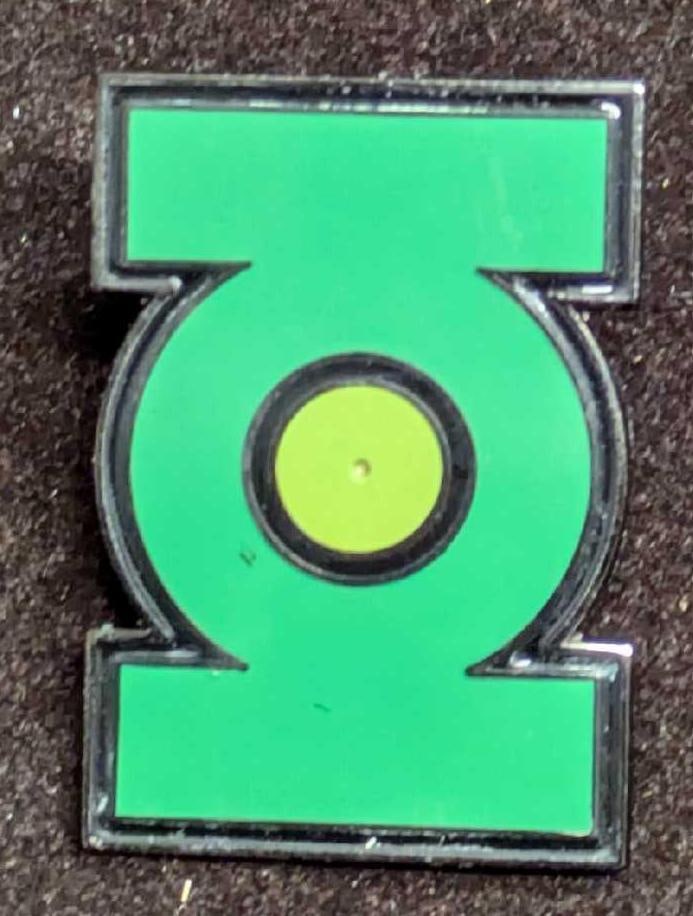 Retired Green Lantern Cloisonne Pin DC Comics: Retired Green Lantern Cloisonne Pin DC Comics. Green Lantern symbol pin comes in its original box that is approx 2 1/4" x 2 3/4" x 3/4" and it weighs 0.06lb. The box has some shelf wear. This was