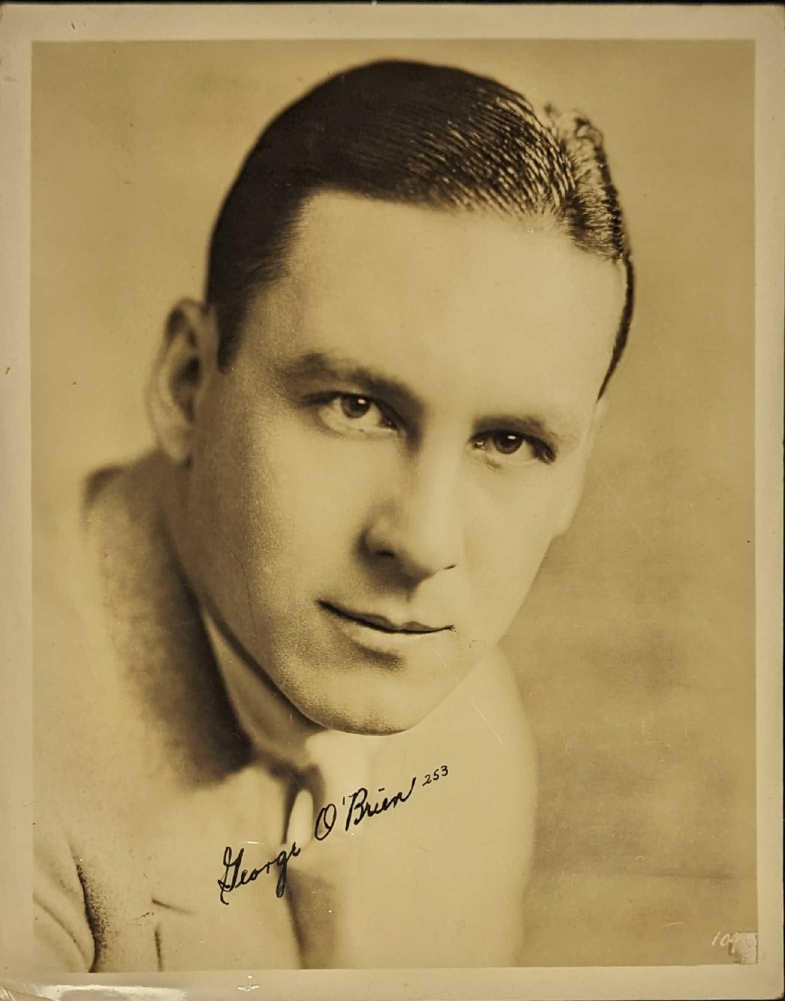 George O'Brien Autographed Publicity Photo: George O'Brien Autographed Publicity Photo. This is approx 7 3/4" x 10" and it weighs 0.02lb. The corners have creases and there is a white marking on the bottom right corner. This