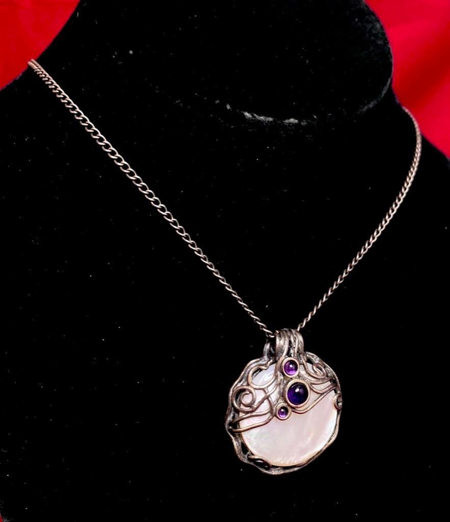 Sterling Silver Mother of Pearl Wire Pendant: This piece of jewelry as been tested and researched prior to testing . Please view all our pictures they are part of our description. DETAILS: Metal - Sterling 925 Color - Silver Stones - Mother of