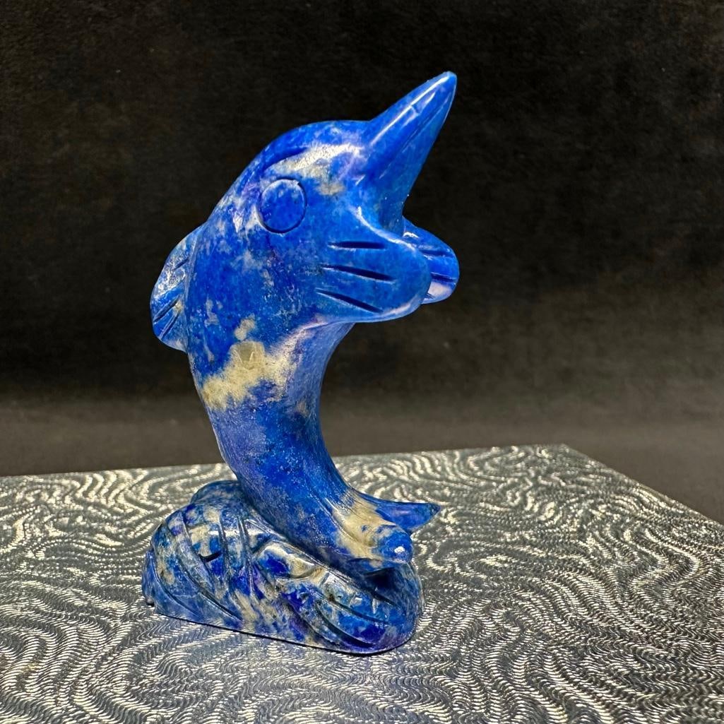 Lapis Lazuli Breaching Dolphin Figurine: This piece of jewelry has been tested and researched prior to listing. Please view all our pictures they are part of our description. DETAILS: Metal - none Color - Blue Stones - Lapis Lazuli Hallmarks