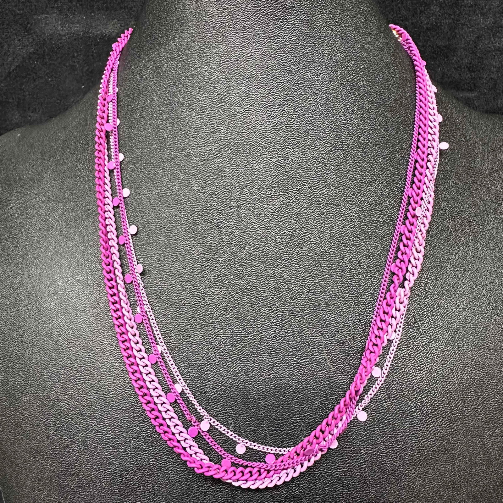 Melania Clara and Alexa Rae Dark and Light Purple Necklace Pair: This Alexa Rae and Melania Clara necklace set features a magnet clasp closure. The necklaces have magnet extender clasp closures. Each necklace showcase modernist designs with gold toned chain