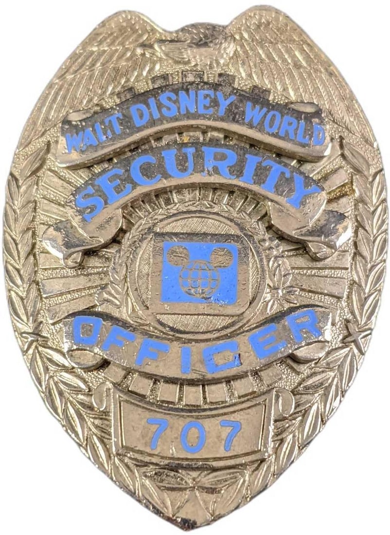 1970s/1980s Disney World Security Metal Badge: 1970s/1980s Disney World Security Metal Badge. Is approx 2 1/4" x 3/4" x 3" and it weighs under one pound at 0.13lb. The metal badge is in a good, vintage condition with some wear, paint loss and mini