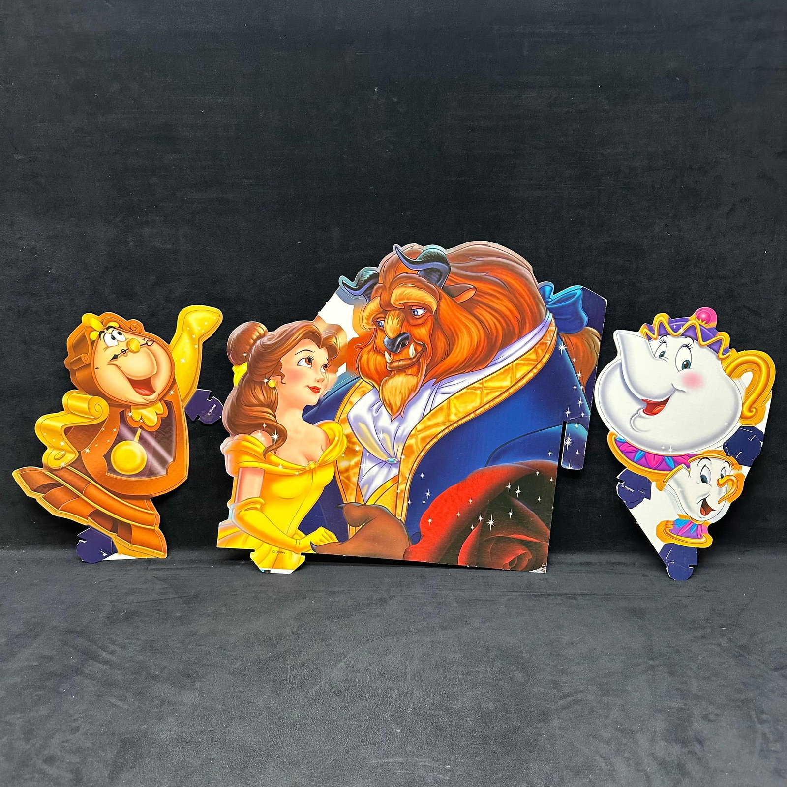 Disney Beauty and The Beast Cardboard Standee Cutout Display Belle Cogsworth Mrs. Potts Chip: Colorful vintage Disney “Beauty and the Beast” cardboard standee set featuring Belle, Beast, Cogsworth, Mrs. Potts, and Chip. Each piece is made of sturdy printed cardboard with fold-out t