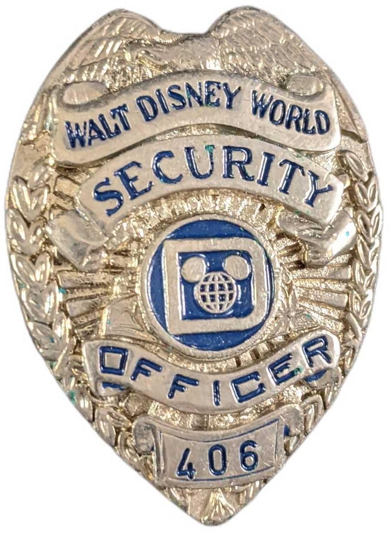 Early 1980s Disney World Female Security Badge: 1970/1980s Disney World Female Security Metal Badge. Is approx 1 1/2" x 1" x 2" and it weighs under one pound at 0.11lb. The metal badge is in a good, vintage condition with some light wear. Please se