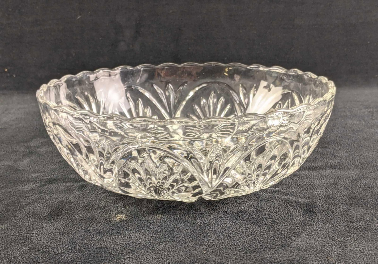 Glass Bowl Glass Cut Bowl: This glass bowl is in good condition it has a few scratches but no major scratches. The bowl has no chips or cracks. This seems to be pressed glass. The design cut into it is lovely. 8in