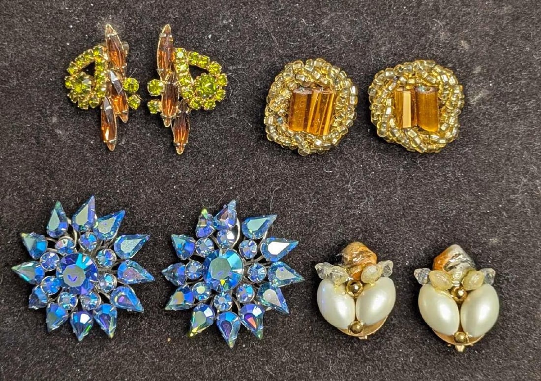 Vintage Of Unsigned Rhinestone AB Crystals Clip On Earrings Lot Of 4: Vintage Of Unsigned Rhinestone AB Crystals Clip On Earrings Lot Of 4. This lot includes: (1) Set Of Silver Tone AB Crystals Clip On Earrings. Each is approx 1 5/8" x 1 5/8"x 1/4". (1) Set 