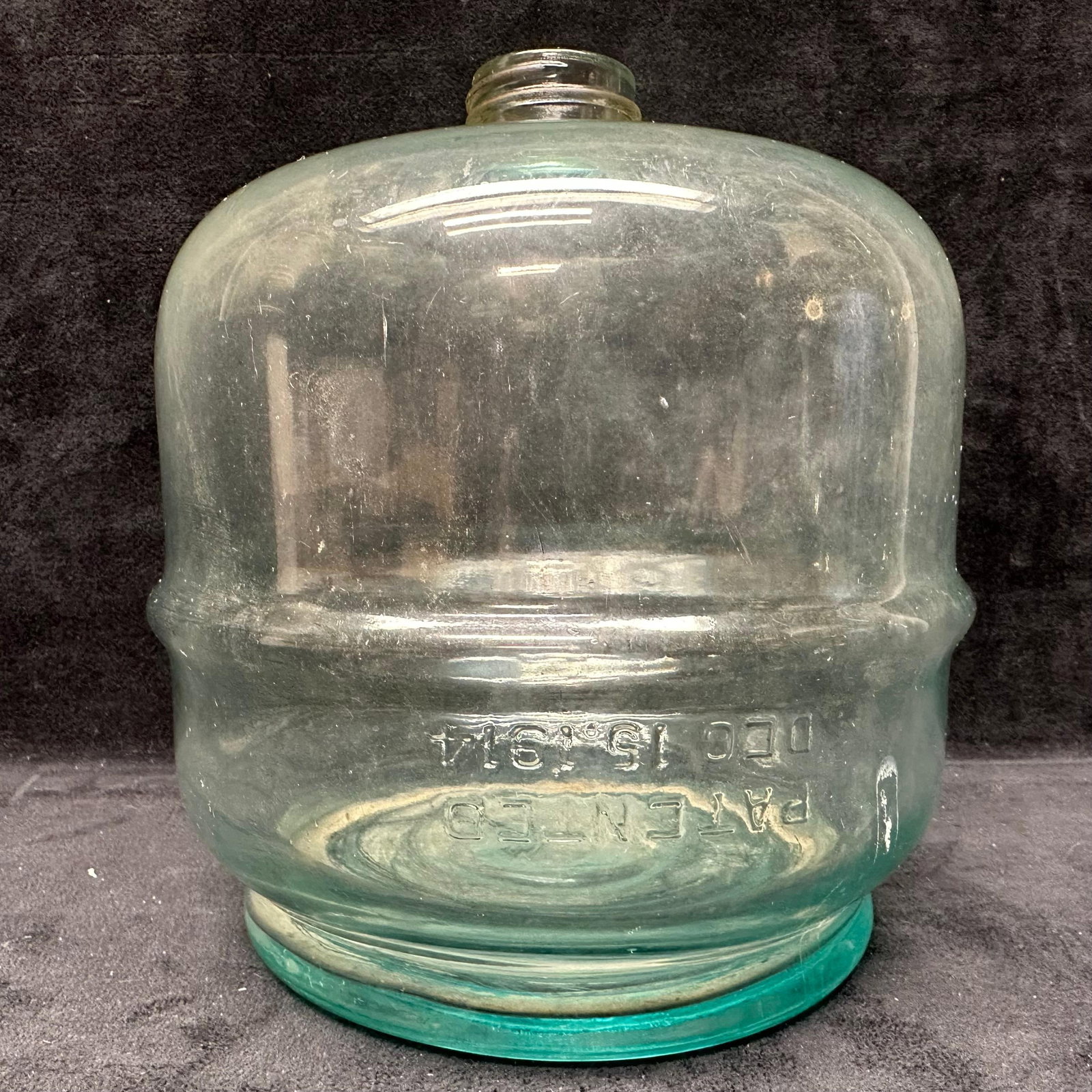 Antique Clear Glass Water Jug Carboy Patented Embossed Kerosene Fuel Dispenser Style 1914: Small early 20th-century clear glass kerosene dispensary-style water jug or carboy featuring embossed lettering reading, PATENTED DEC. 15, 1914. Thick, heavy glass with a wide, rounded body, thre