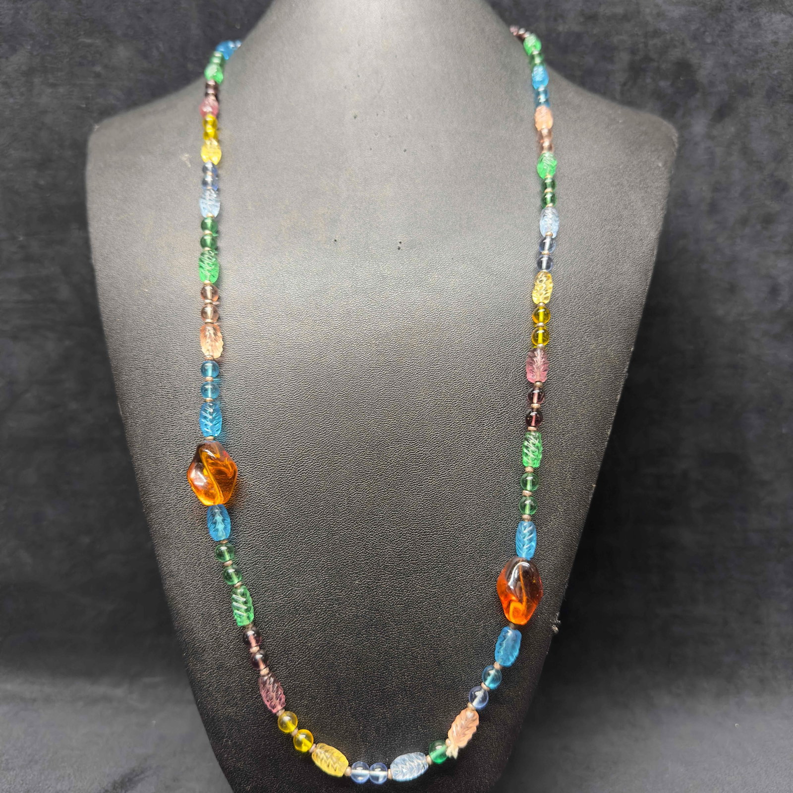 Murano Venetian Lamp Work Art Glass Light Multi Color Beaded Necklace G17: Murano Venetian Lamp Work Art Glass Light Multi Color Beaded Necklace G17. Necklace with light multi colored glass beads with beautiful designs on each. The necklace features several shaped beaded acc