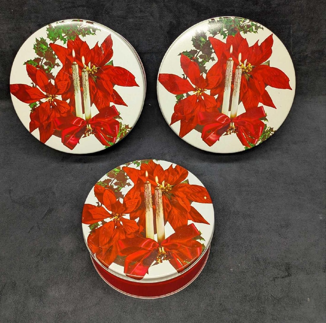 3 Vintage Christmas Poinsettias Candles Round Tins: 3 Vintage Christmas Poinsettias Candles Round Tins. The two large round tins are approx 10" x 10" x 3 1/2" and the smaller tin is 8 1/4" x 8 1/4" x 3". The total weight is 2.29lb. The tops have