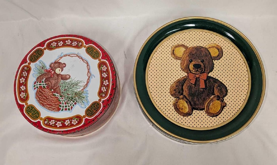 2 Vintage Teddy Bear Round Tins: 2 Vintage Teddy Bear Round Tins. This lot includes: (1) Parco Foods (1985) Brown Teddy Bear With Red Ribbon Tin. This is approx 10" x 10" x 3 1/4". (1) The Tin Box Company Of America Inc T