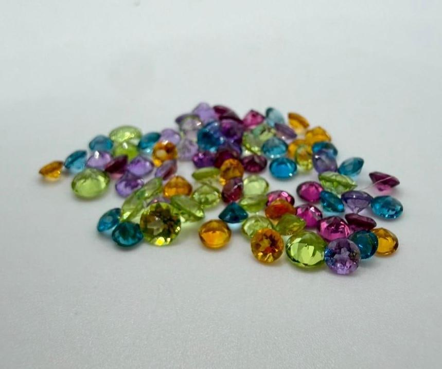 Lot of Mixed Color Gemstones - 9 ct Total: Lot of Mixed Color Gemstones - 9 ct Total Approximately 9 carats of small, round-cut, mixed color gemstones. Exact types unknown.