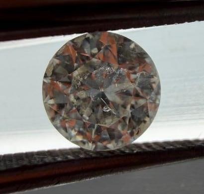 Pair of Round Cut Diamonds - .5 ct Each: Pair of Round Cut Diamonds - .5 ct Each Two round diamonds, each weighing approximately 1/2 carat each (for a total weight of just over 1 carat). Color is approximately K-L and clarity is