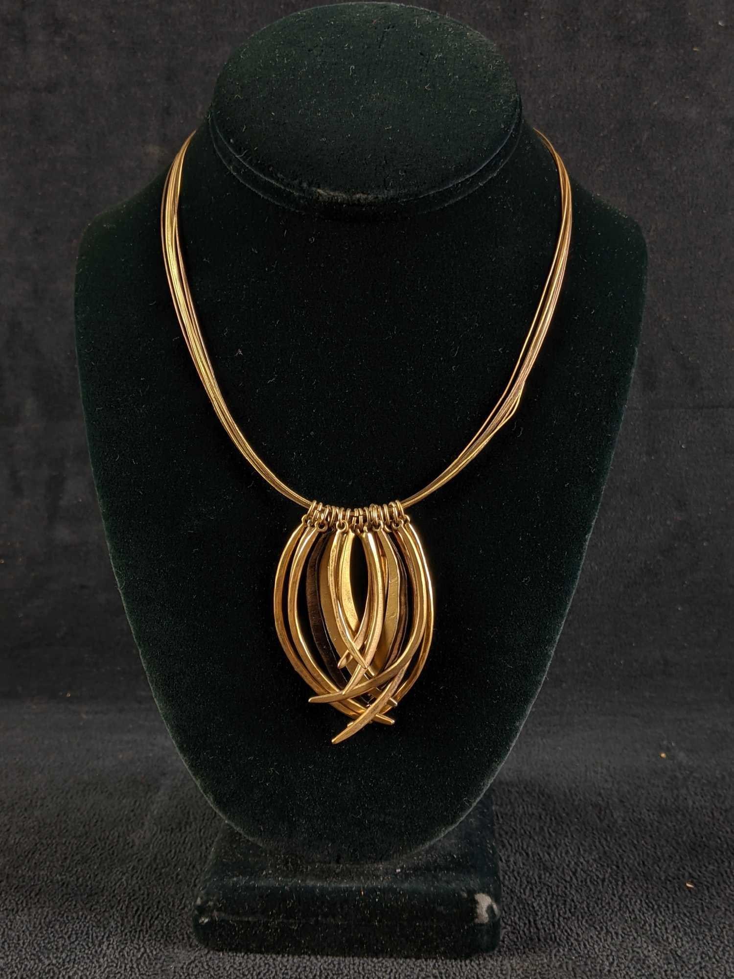 Chicos Gold Colored Necklace: Chico's Gold Colored Necklace This is a gold and black colored necklace from Chico's. It is in good condition with a working clasp 