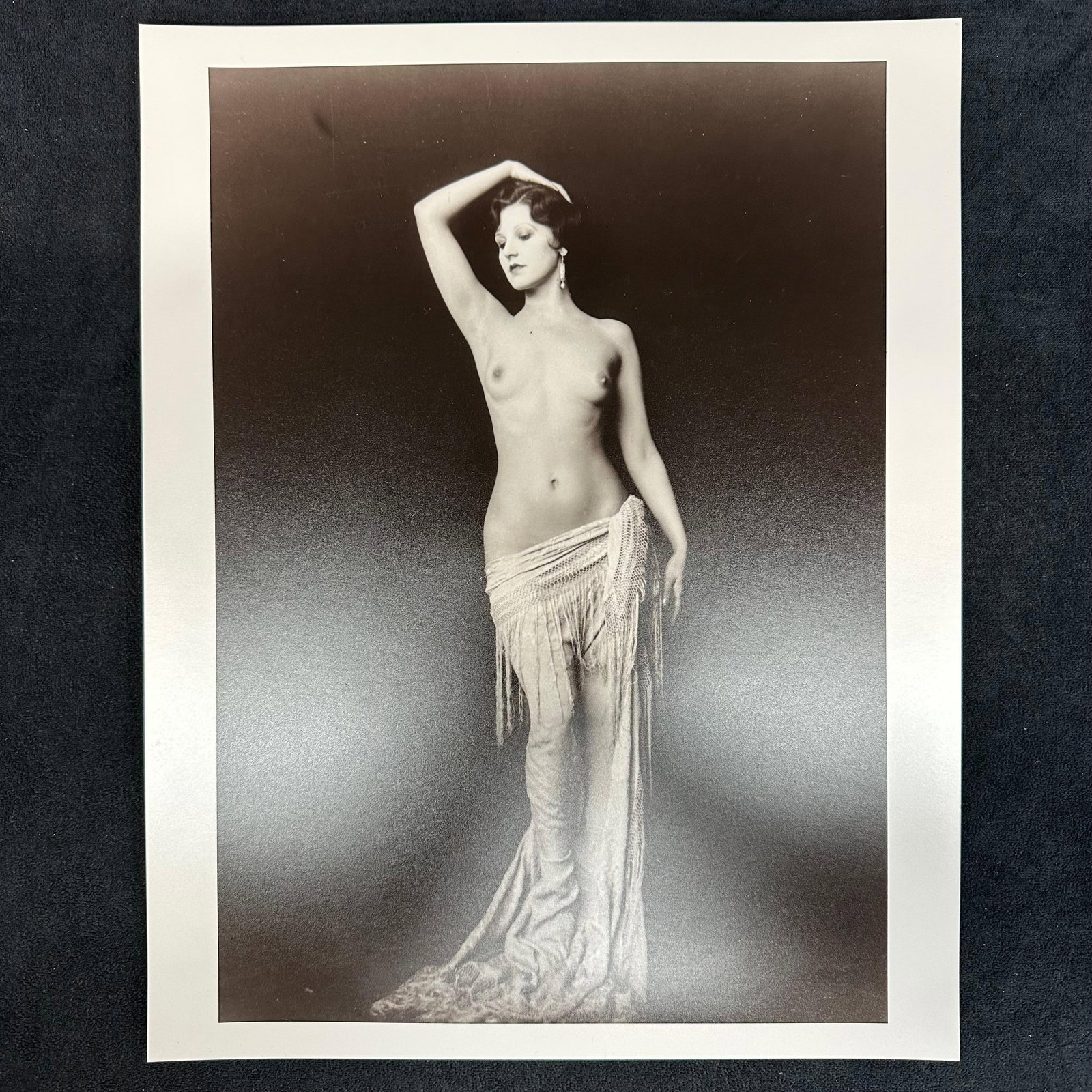 Black and White Analog Photograph Dorothy Knapp Nude Portrait #2: Vintage black and white analog photo print depicting Dorothy Knapp in a classic nude portrait pose, draped in a fringed wrap. Elegant and evocative 20th-century studio composition. This item is in