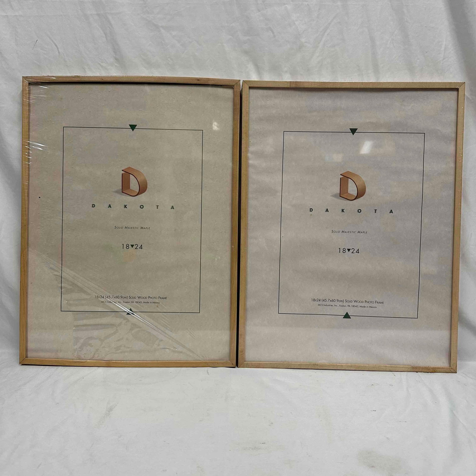Set of MCS Dakota 18" x 24" Majestic Maple Solid Wood Photo Frames: Lot of two (2) matching MCS industries brand Dakota frames, solid majestic maple wood, sized 18" x 24" inches. Each frame is like new partially wrapped in original plastic. Showing signs of