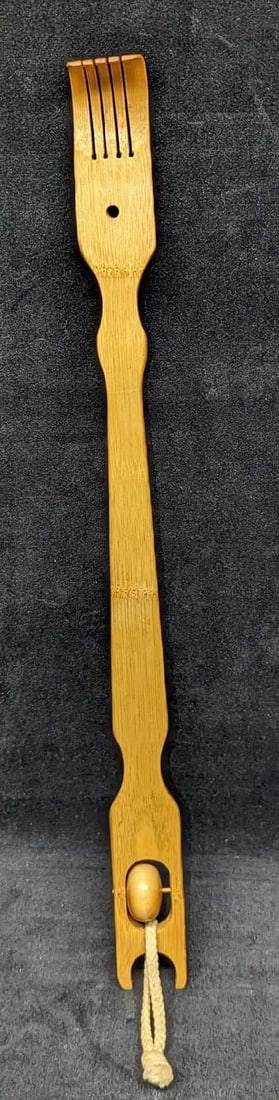 Bamboo Back Scratcher With Roller: Bamboo Back Scratcher With Roller. Its maker and date of creation are unknown. Is approx 19" x 1 1/2" x 1" and it weighs 0.16lb. The backscratcher has some signs of wear.