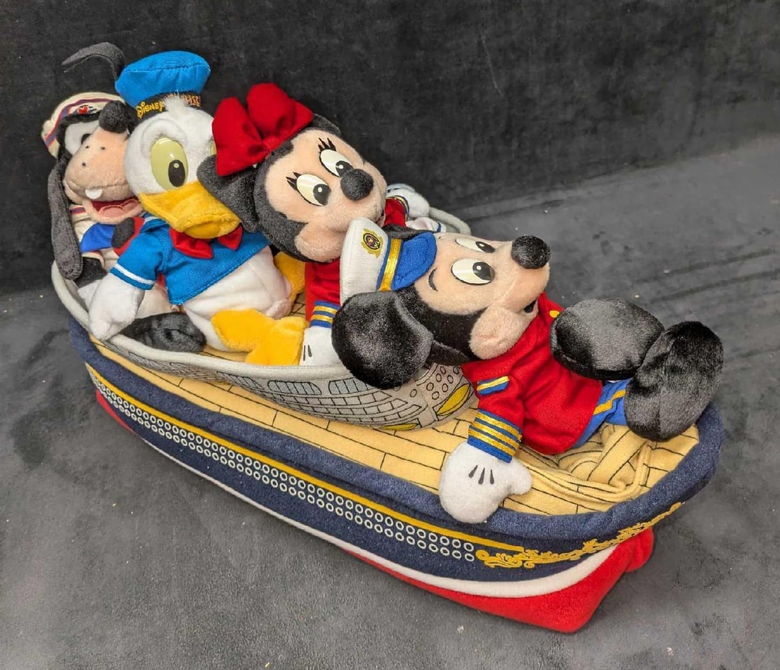 Disney Cruise Line Captain Mickey, Minnie, Donald, Goofy and Ship Plush Set: Disney Cruise Line Captain Mickey, Minnie, Donald, Goofy and Ship Plush Set. Comes in the original carrying case that is approx 18" x 8" x 11" and it weighs 2.20lbs. The case has some shelf wear.