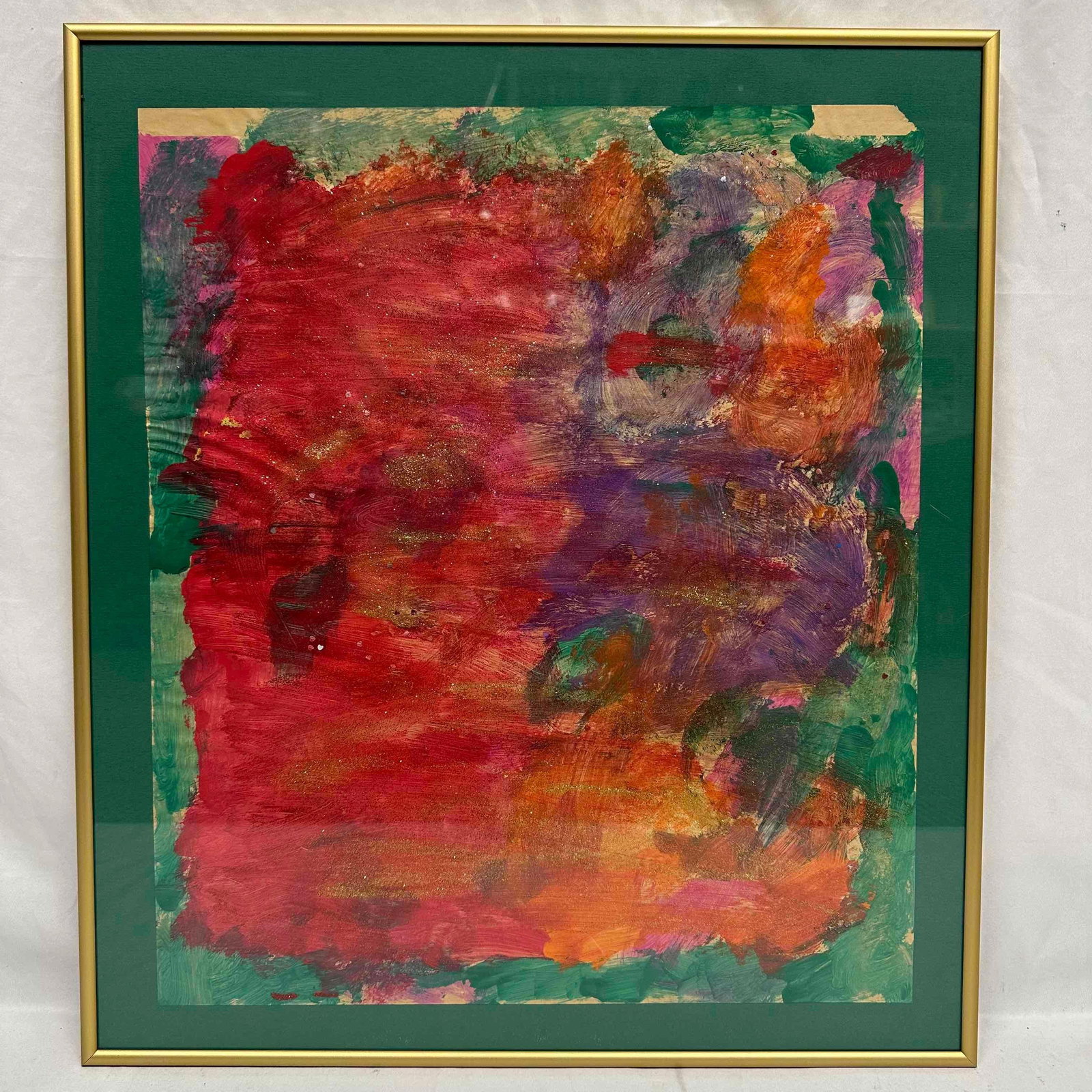 Framed Abstract Mixed Media Painting on Paper Bold Red Purple and Orange: Vibrant abstract mixed media painting on paper featuring bold layers of red, purple, orange, and green with hints of metallic shimmer. The work is matted in green and set in a gold-tone metal frame