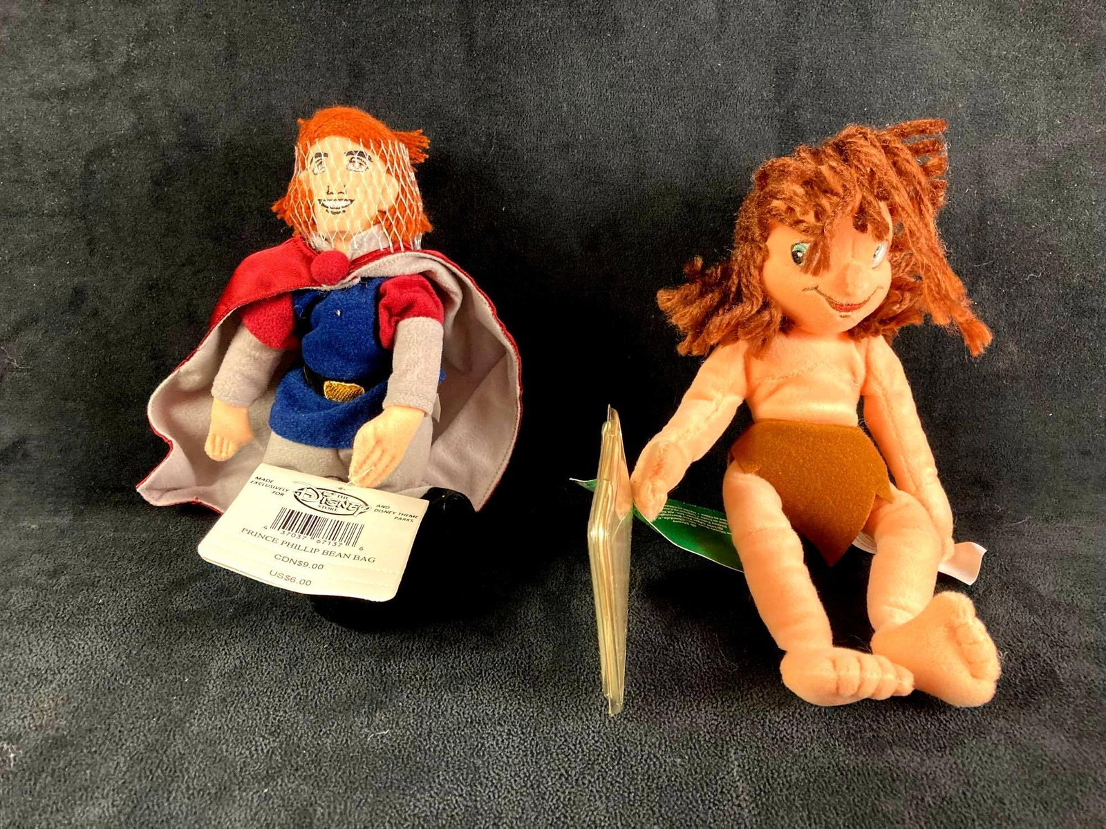 Set of (2) Disney Plush Bean Bag Dolls Tarzan and Prince Phillip: Up for auction is a recent estate find, a set of two Disney bean bag plush dolls in particular Young Tarzan and Prince Phillip. They came from a large collection of Disney items collected over twenty 