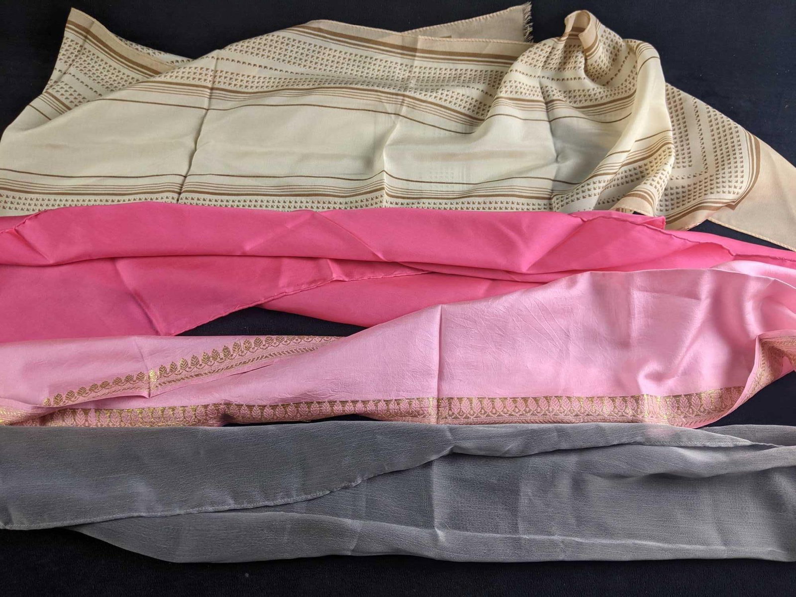 Assorted Vintage Scarves: Assorted Vintage Scarves There are four scarves in this lot. They are in good condition and have no known damage just creases from folding. They are assorted types of materials. 