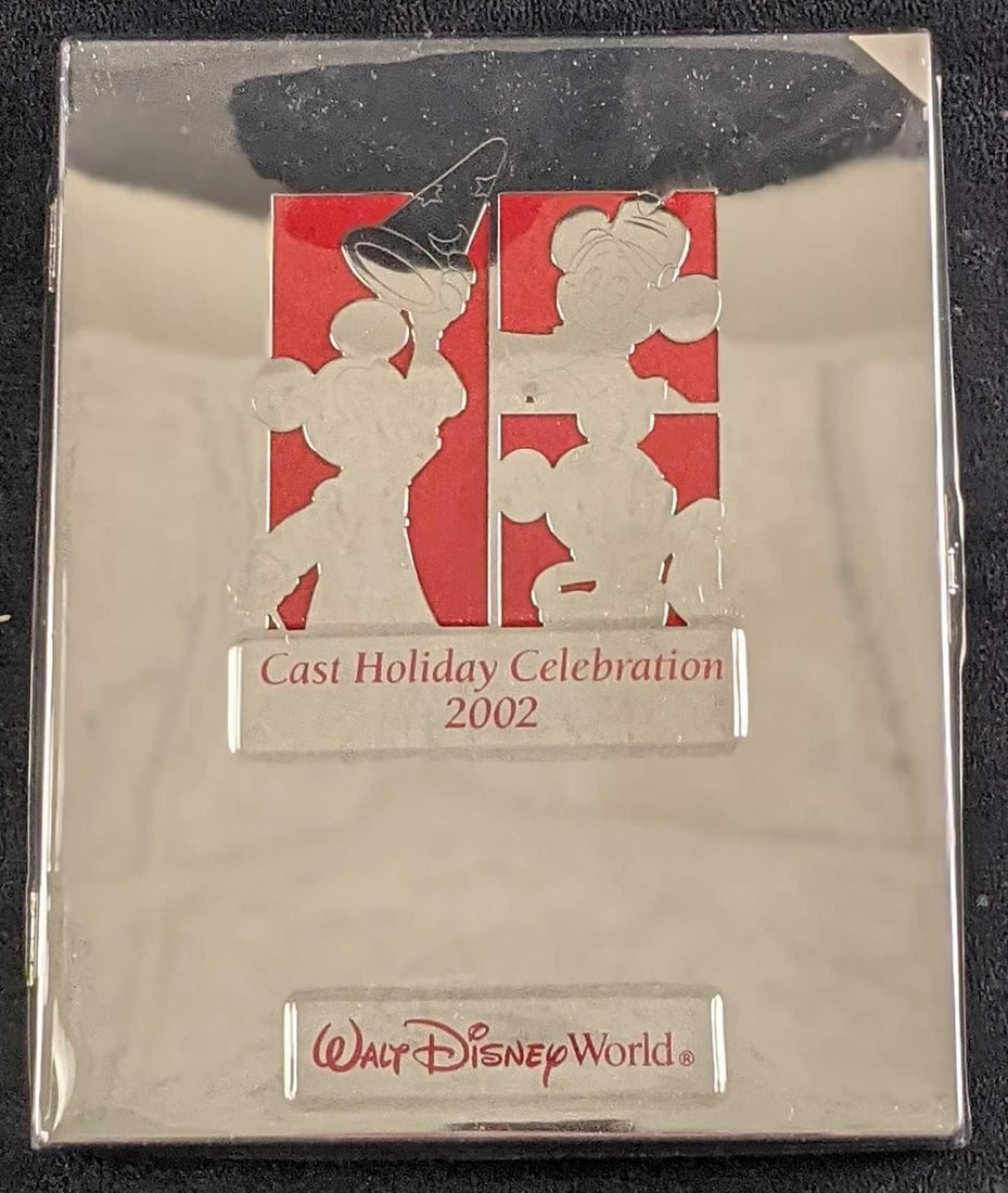 Disney Cast Holiday Celebration 2002 Picture Frame Book: Disney Cast Holiday Celebration 2002 Picture Frame. Was originally given to Disney Employees For The Disney Holiday Celebration For 2002. This picture frame book opens up and a 5" x 7" photo can be