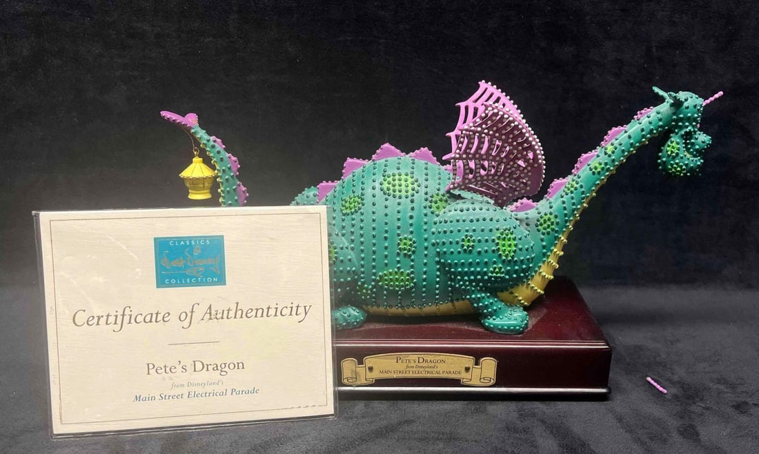 Walt Disney Classics Collection Pete's Dragon Figurine Main Street Electrical Parade: This lot contains a Walt Disney Classics Collection Pete's Dragon Figurine From The Main Street Electrical Parade. Unfortunately the Parade retired in 2001 and was brought back for a short
